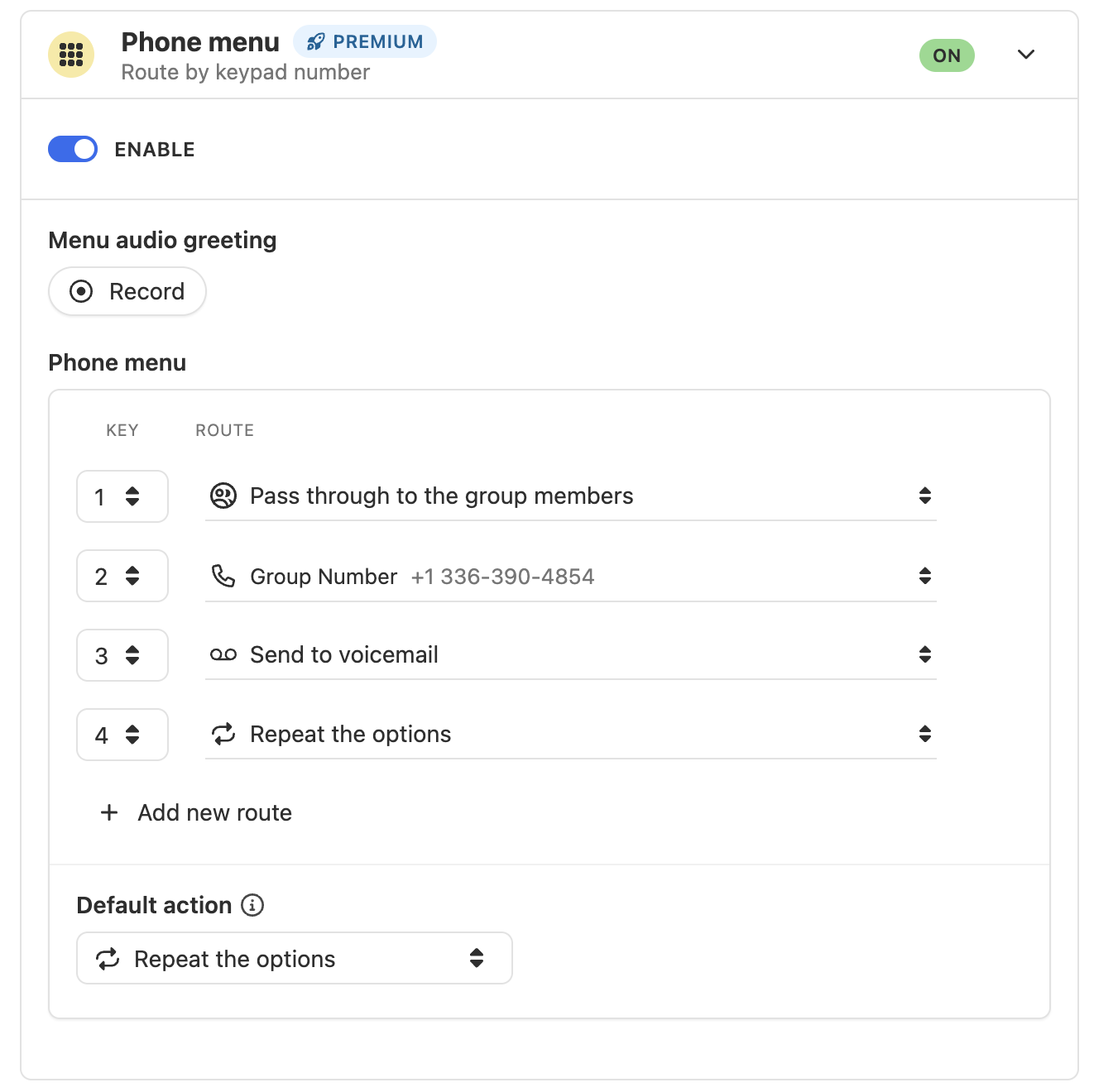 Premium phone menu settings showing enabled toggle, menu greeting record option, keypad routes for keys 1–4, and default action.