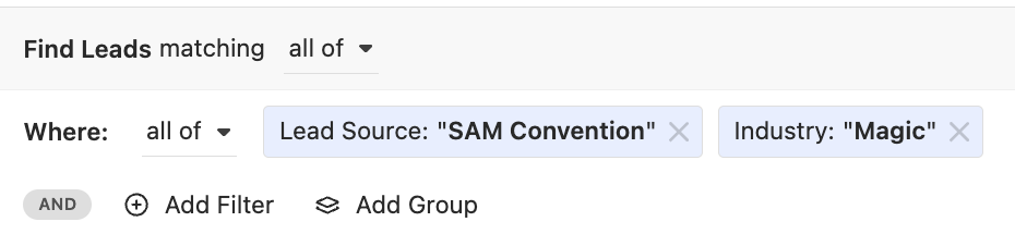 Smart View filter row showing Lead Source and Industry chips for SAM Convention and Magic.