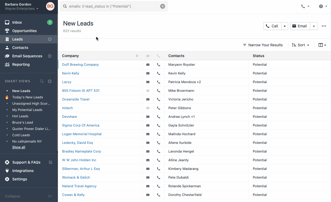 CRM leads list showing company, contacts, and status with New Leads smart view selected.