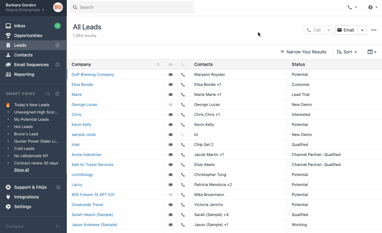 CRM leads list showing companies, contacts, and lead statuses with a left sidebar of Smart Views.